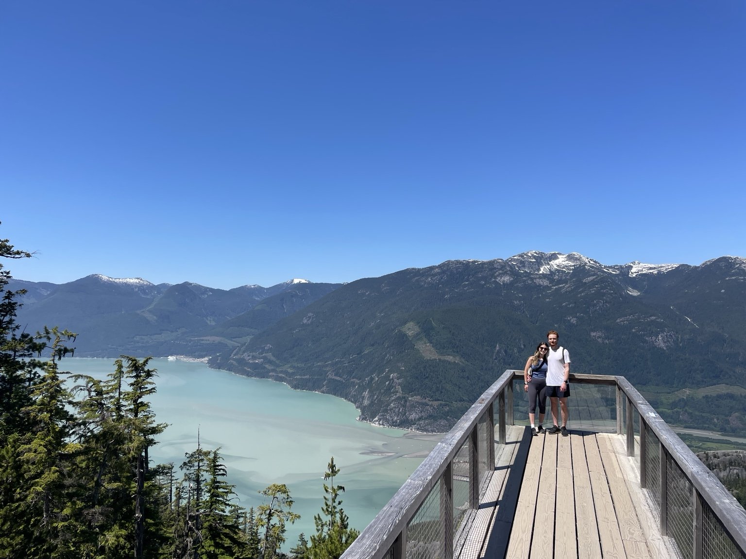 Nick and Carly overlooking Howe Sound from the Sea to Sky Gondola