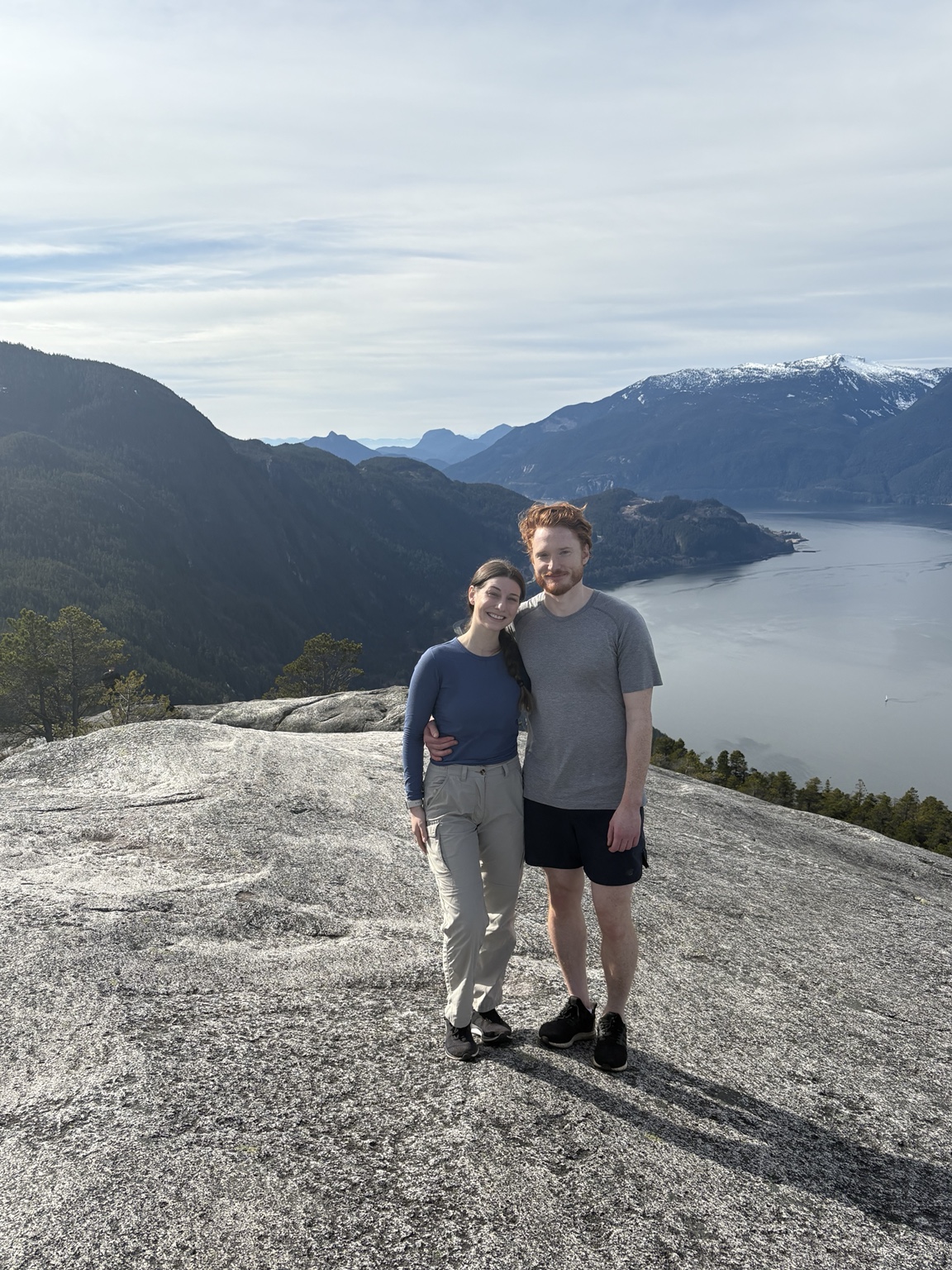 Nick and Carly on a granite summit overlooking Howe Sound from the Stawamus Chief